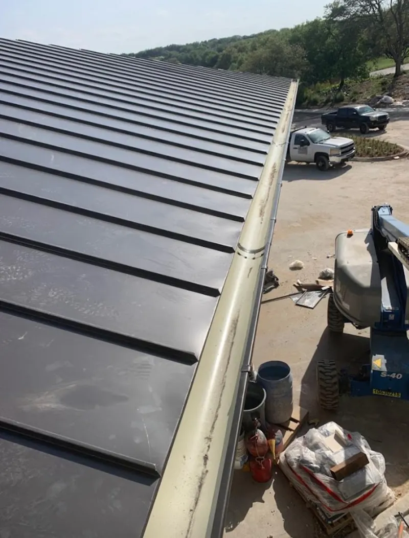 Standing seam panel and gutter detail on a metal roofing jobsite in Vineyard